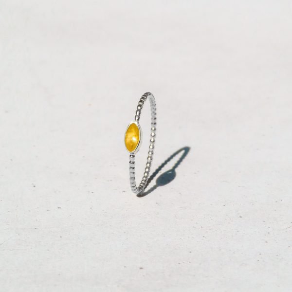 Joy Ring in sterling silver with a blue topaz